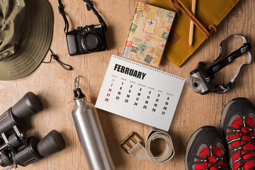 table top of safari equipment including calendar month when best to visit Kenya